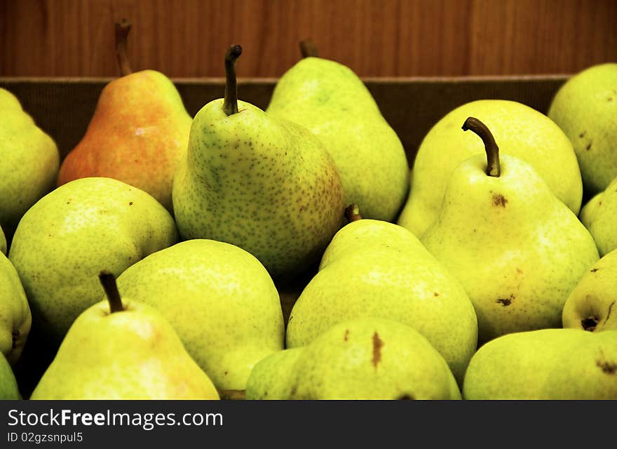 Basket of ripe pears up close