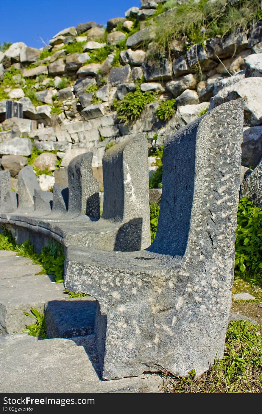 Photo of Seat carved in black rock at the roman theater in Um-Qais - Jordan. Photo of Seat carved in black rock at the roman theater in Um-Qais - Jordan