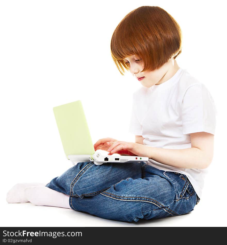 Little girl using laptop over white