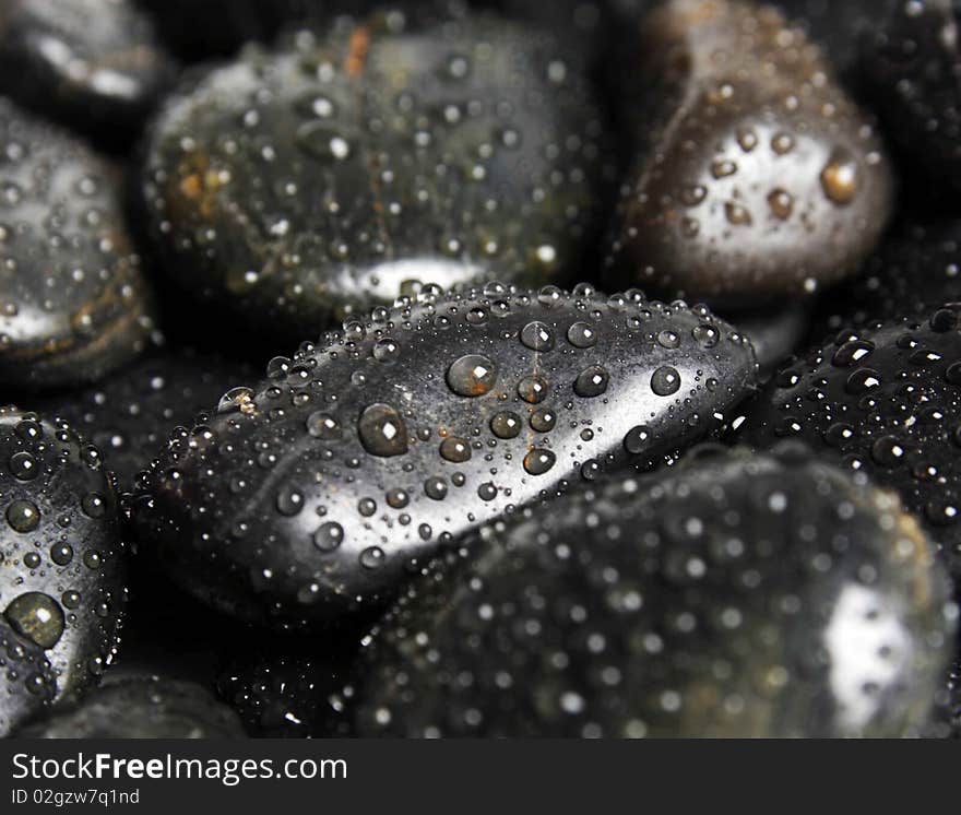 Spa black stones with water drops