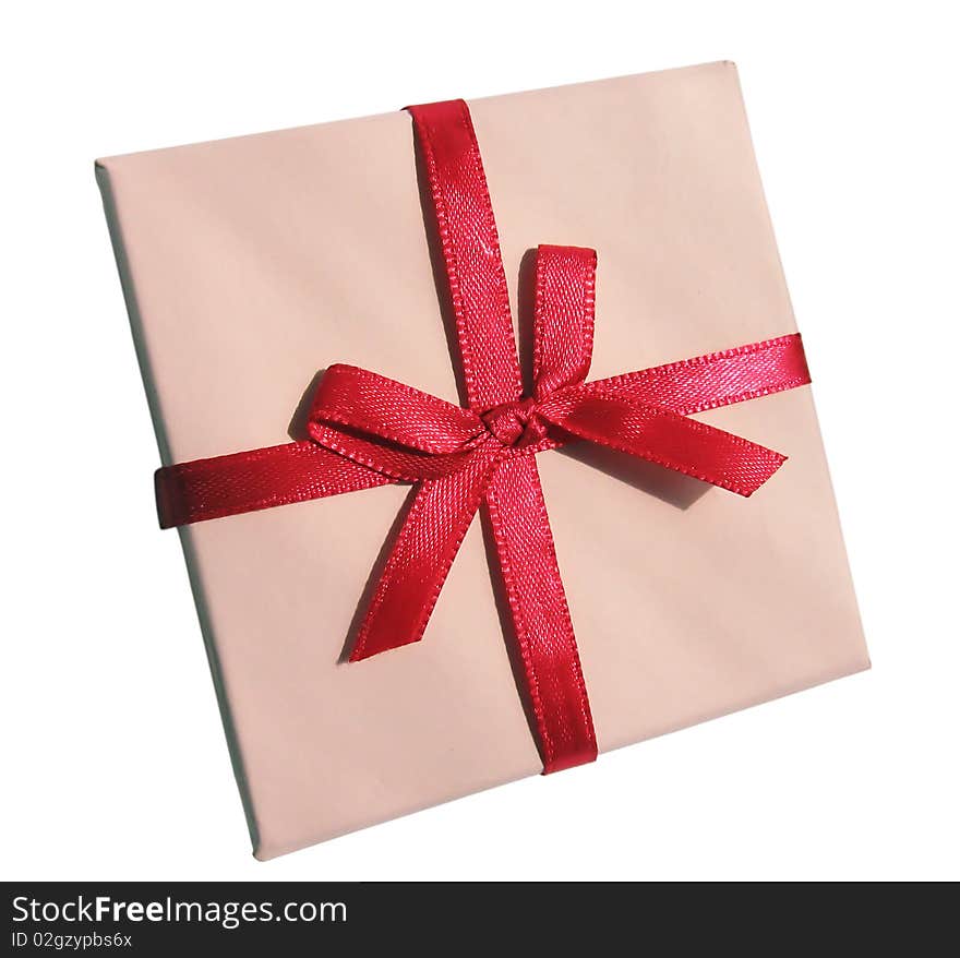 The pink gift box with red ribbon, isolated on a white background