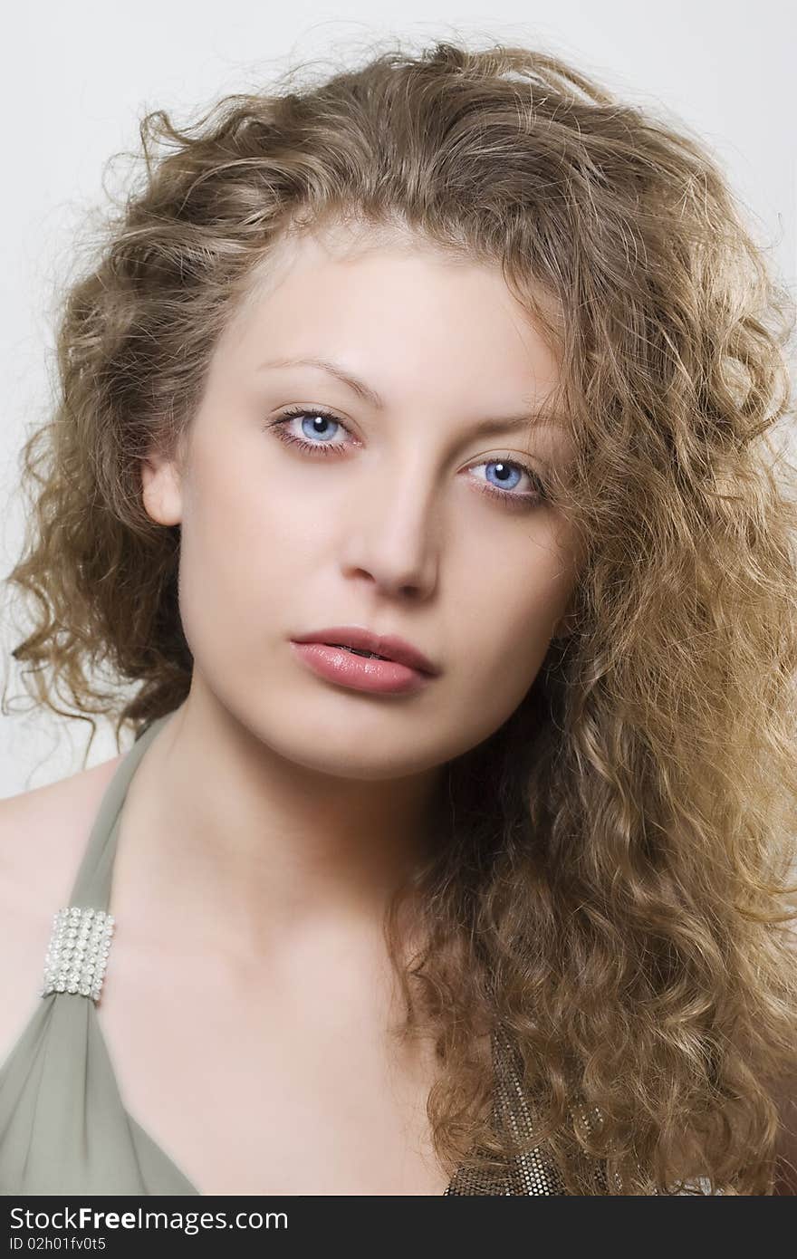 Portrait of beautiful woman with curly hair.