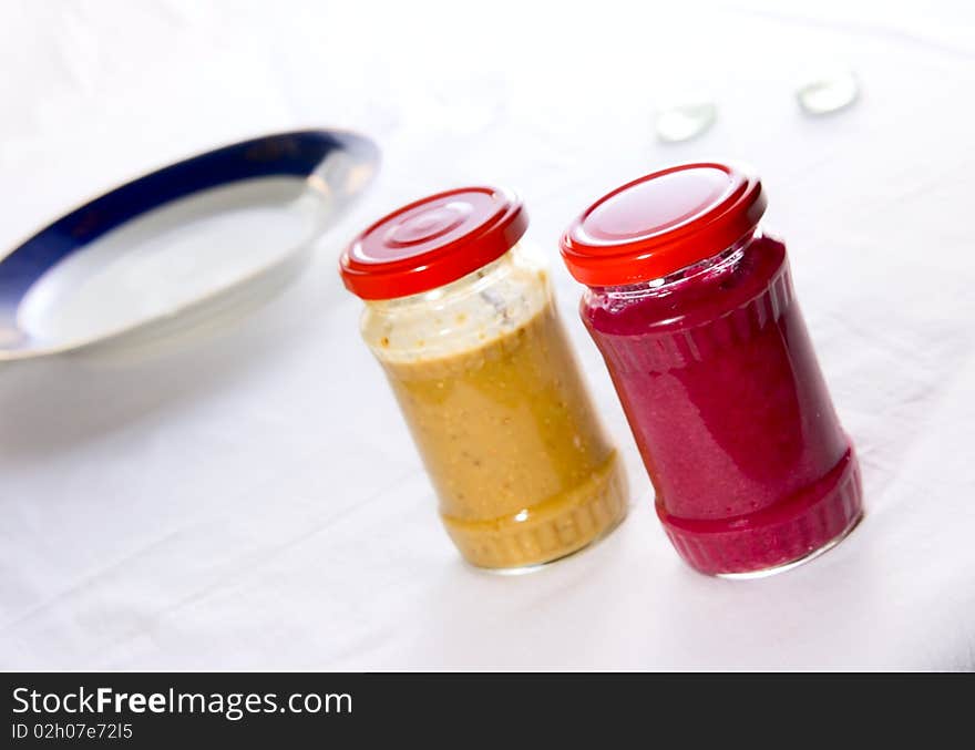 Two tasty color sauce in jars. Two tasty color sauce in jars