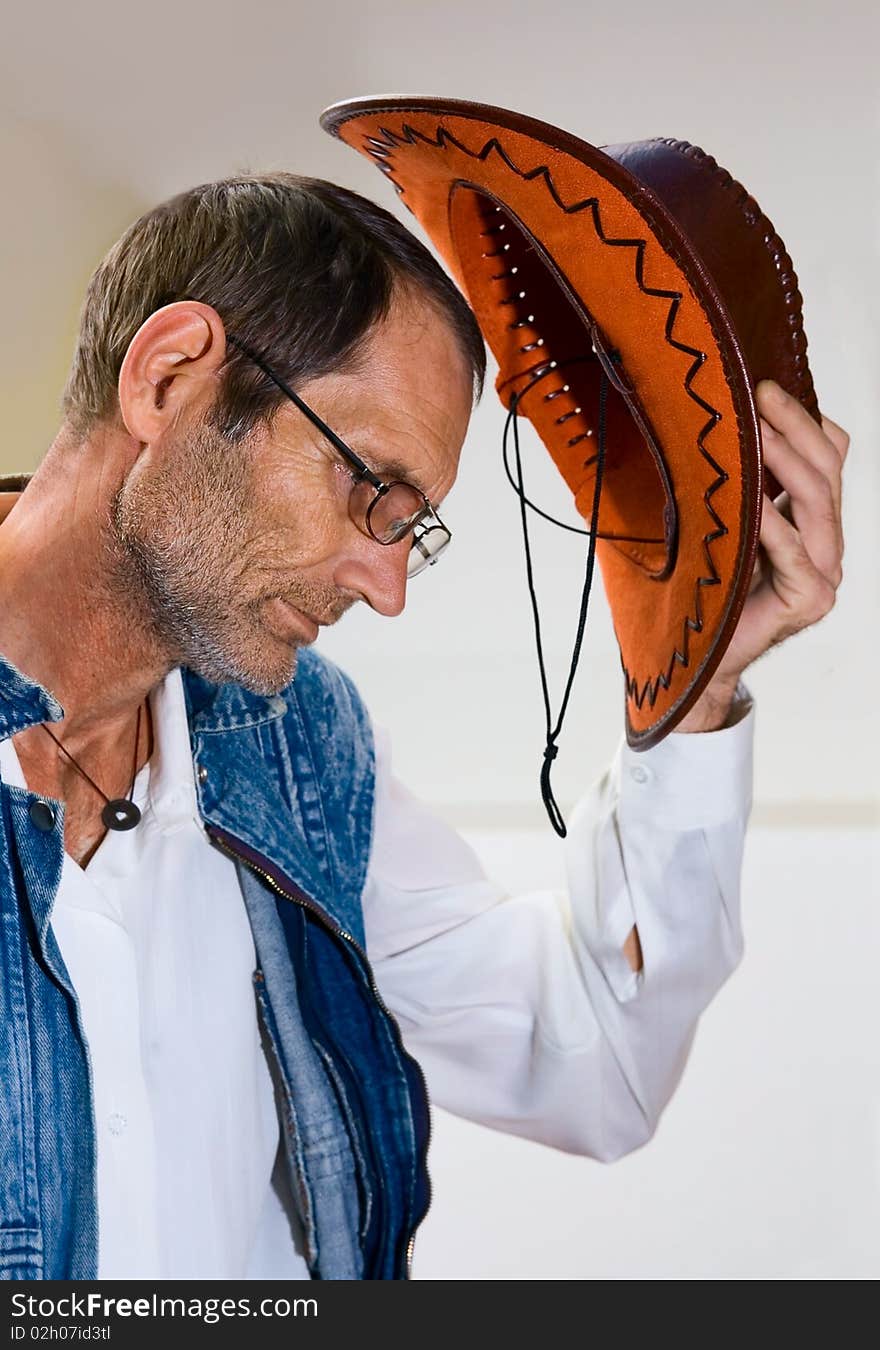 Old Man in glasses with cowboy hat