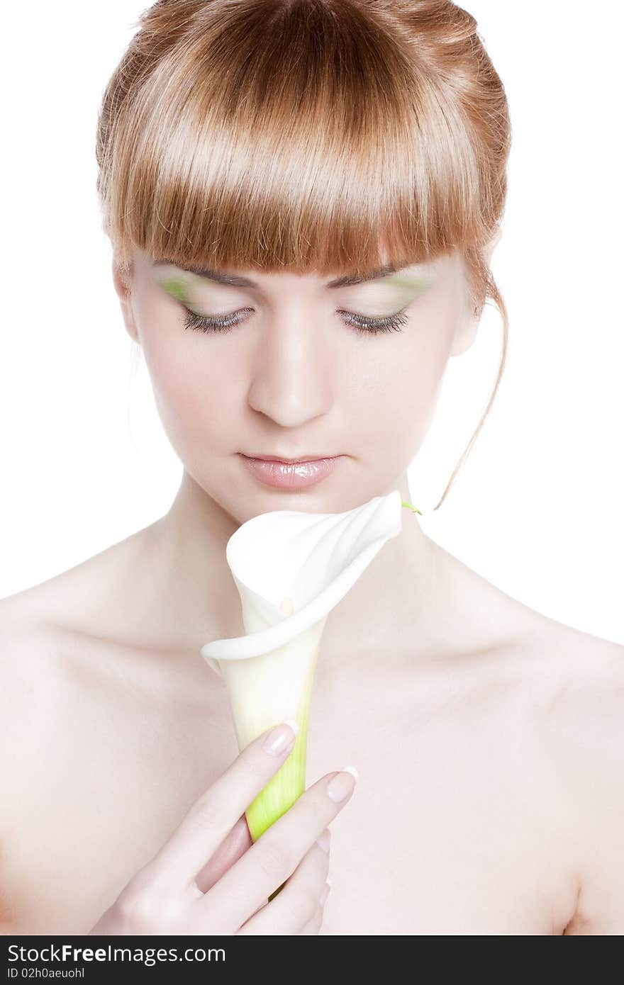 Beautiful young woman with a white flower on a white background. Beautiful young woman with a white flower on a white background