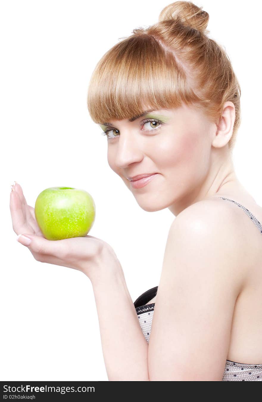 Beautiful smiling girl with green apple