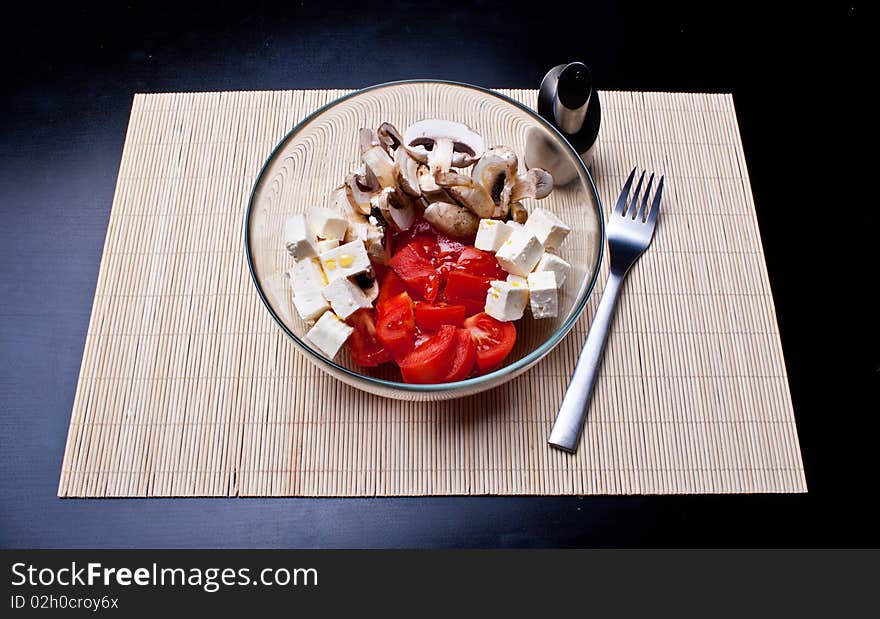 Italian salad with tomatoes, mushrooms and cheese