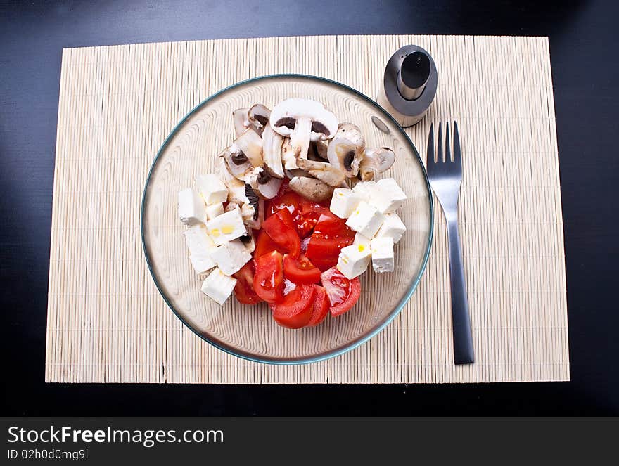 Italian salad with tomatoes, mushrooms and cheese