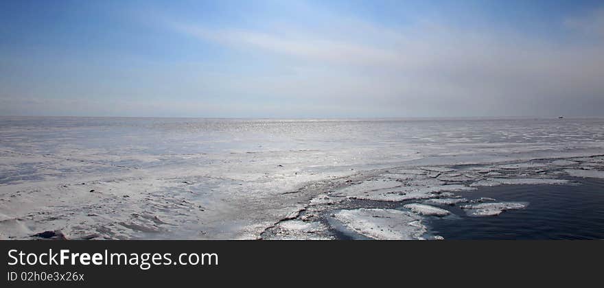 Frozen Lake Baikal. Spring. Day.