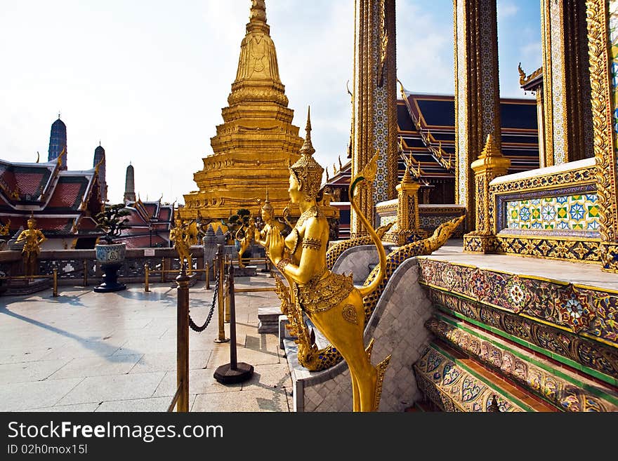 A kinaree, a mythology figure, is watching the temple in the Grand Palace. A kinaree, a mythology figure, is watching the temple in the Grand Palace