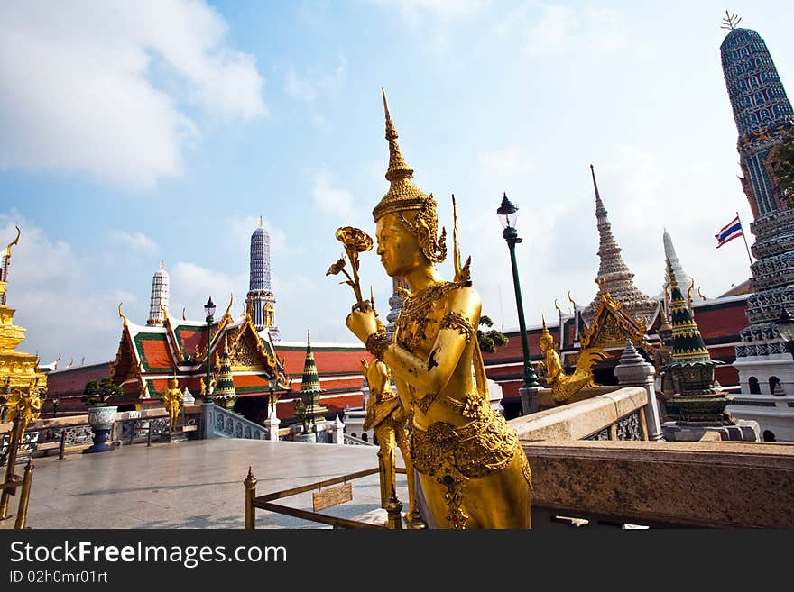 A kinaree, a mythology figure, is watching the temple in the Grand Palace. A kinaree, a mythology figure, is watching the temple in the Grand Palace