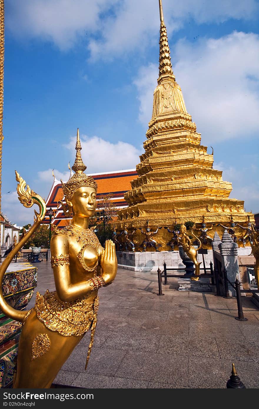 A kinaree, a mythology figure, is watching the temple in the Grand Palace. A kinaree, a mythology figure, is watching the temple in the Grand Palace