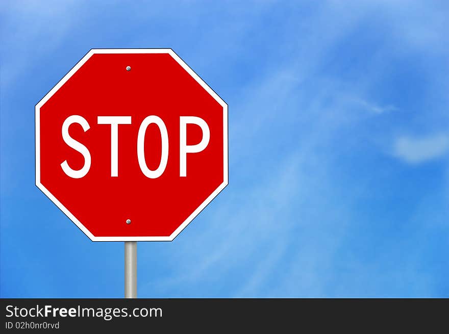 A stop sign against a blue sky.