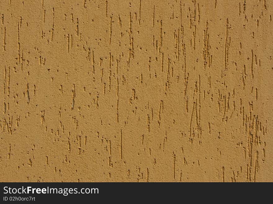 Fragment of a wall of yellow colour, abstract background