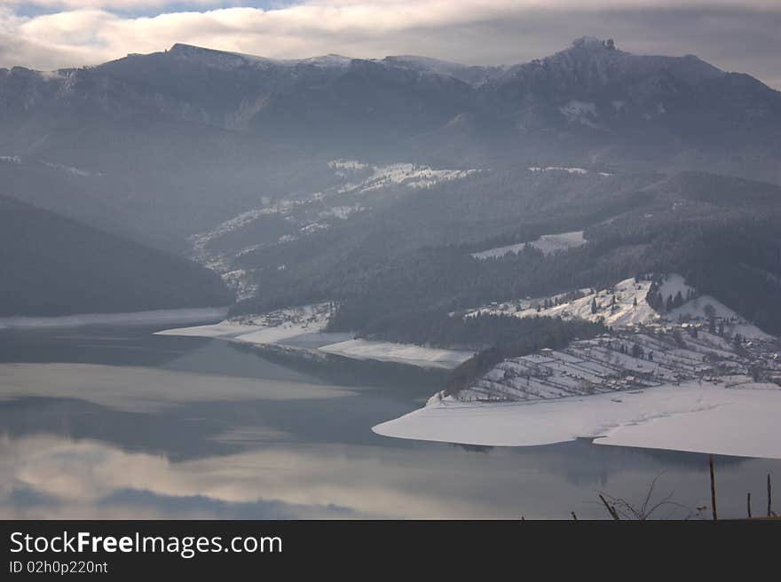 Ceahlau mountain and Bicaz lake (Romania) in a winter morning