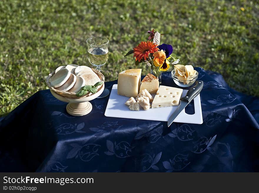 Picnic table in a garden on a sunny day. Picnic table in a garden on a sunny day