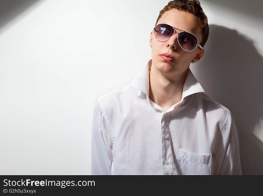 Portrait of young handsome man in sunglasses