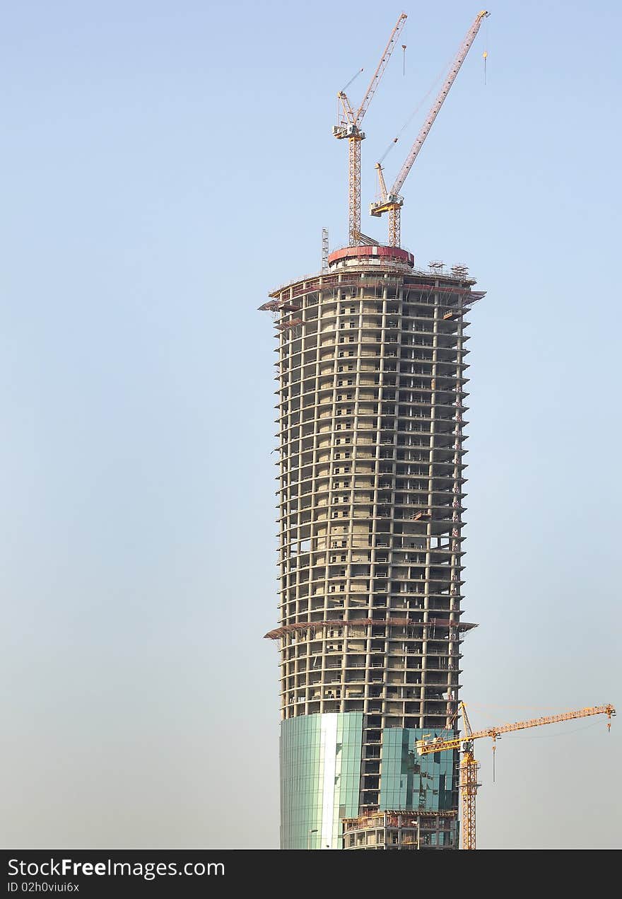 Crane At Work On Twisted Tower