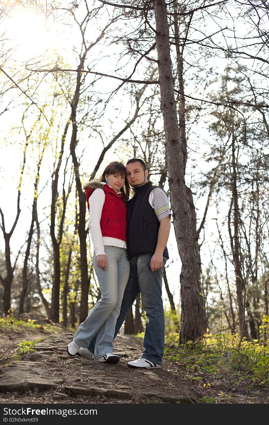 Teenager girl and boy posing and looking at camera. Teenager girl and boy posing and looking at camera