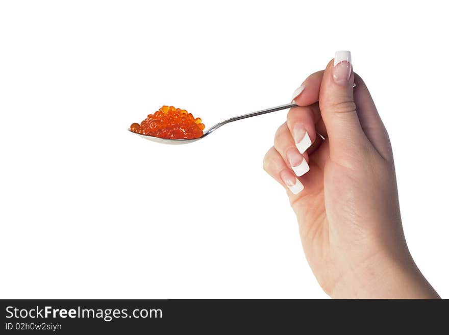 Human hand holding a spoon with red caviar