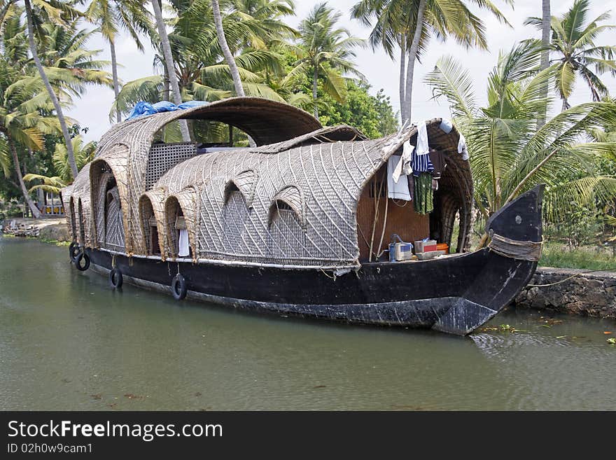 A converted rice barge ( kettuvallam ) on the backwates of Kerala, India