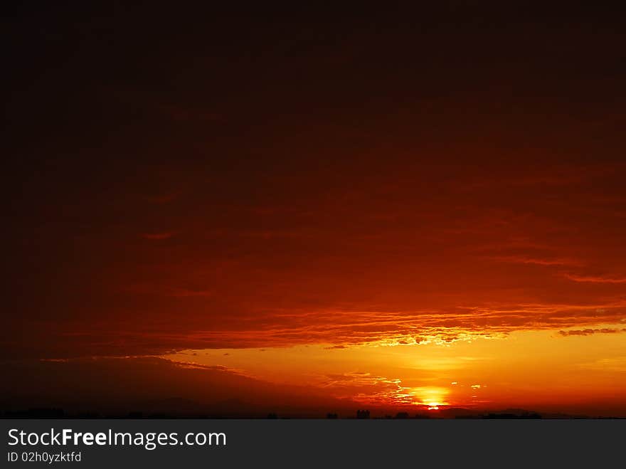 Beautiful sunrise with dark clouds.