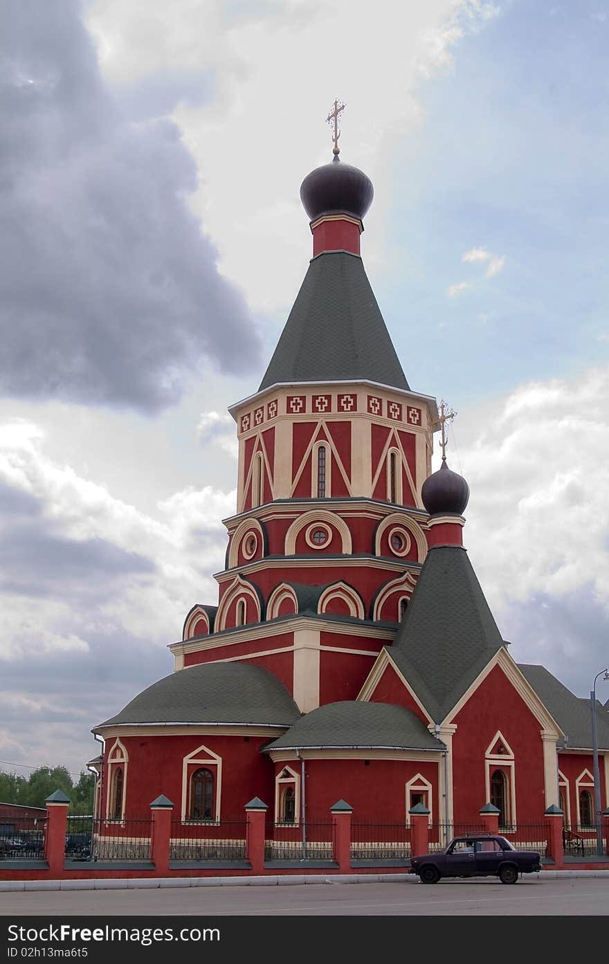 Red russian church at cloudy day