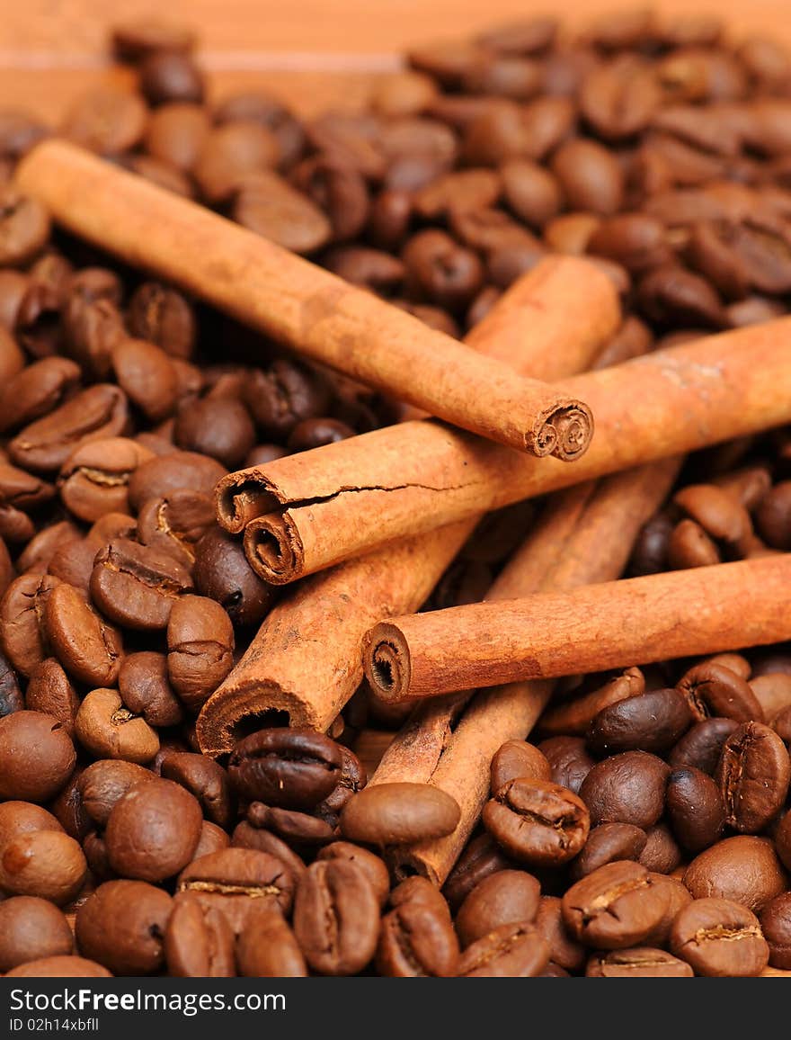 Background of coffee beans andcinnamon sticks. Background of coffee beans andcinnamon sticks