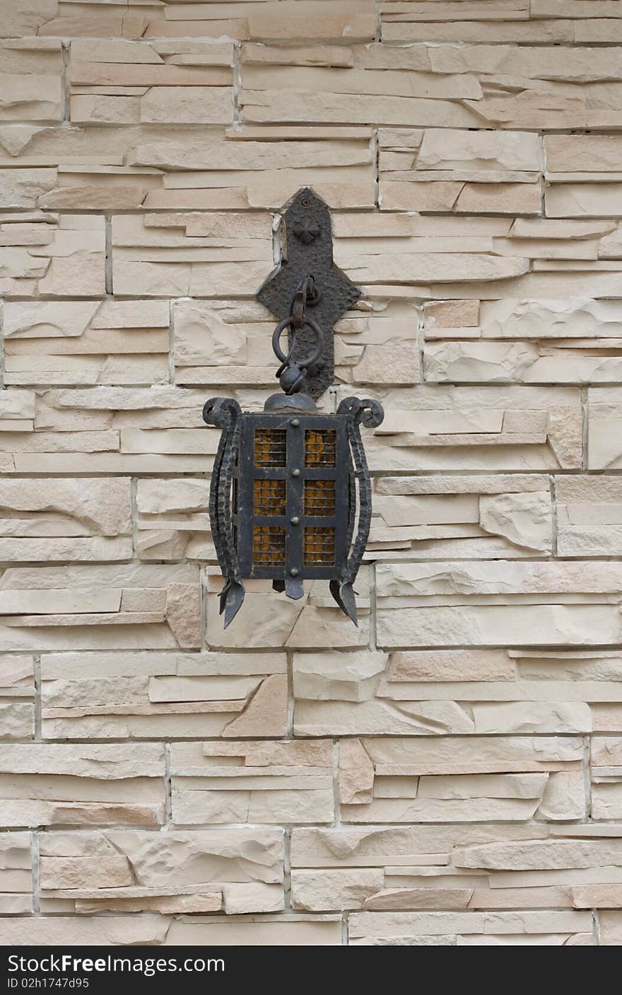 The lantern on the stone wall. Out door.