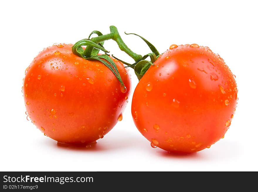 Two ripe tomatoes on a white background.