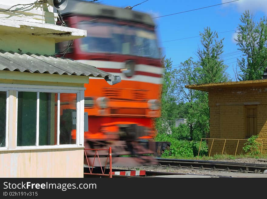 Locomotive in road crossing blue sky