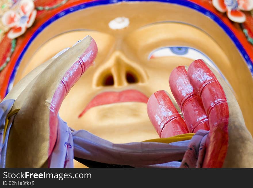 A close up shot of Buddha's face.