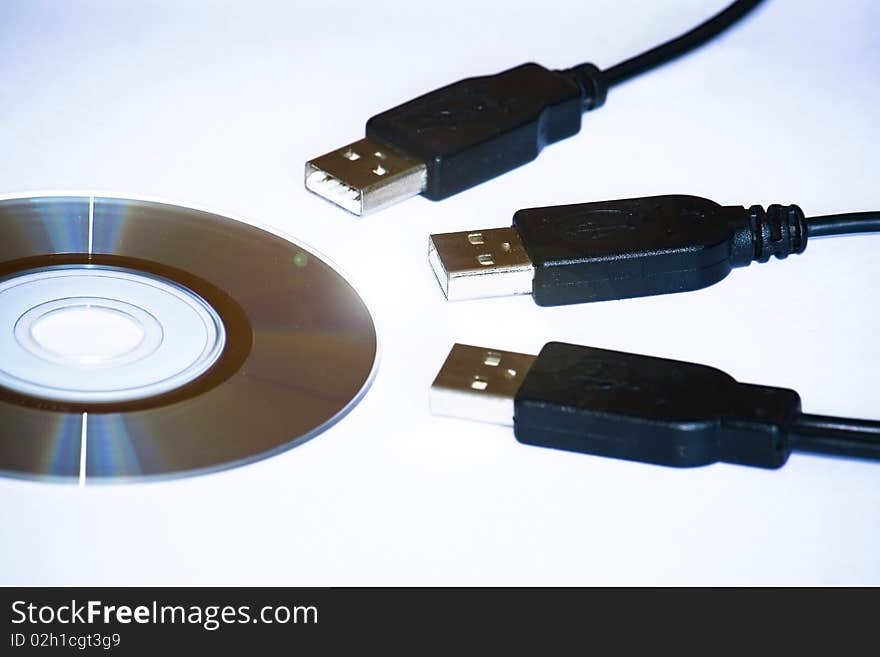 Three USB plugs are transfering files from DVD. Three USB plugs are transfering files from DVD