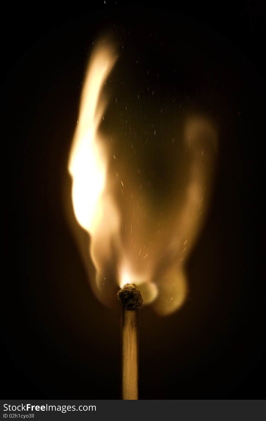 A macro shot of burning match head on the black background