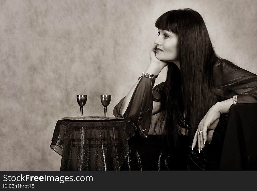 Beautiful woman with silver   wineglass