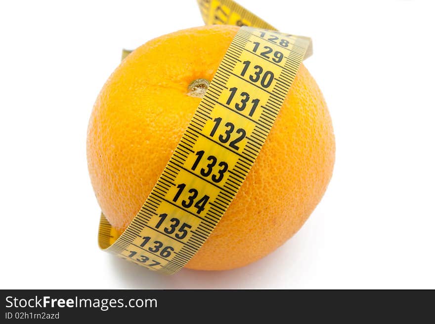 Fresh orange with measuring tape