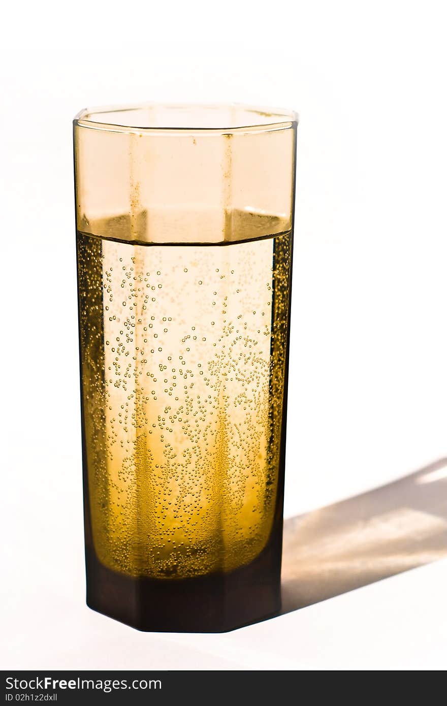 Glass vessels standing on the white table, isolated background