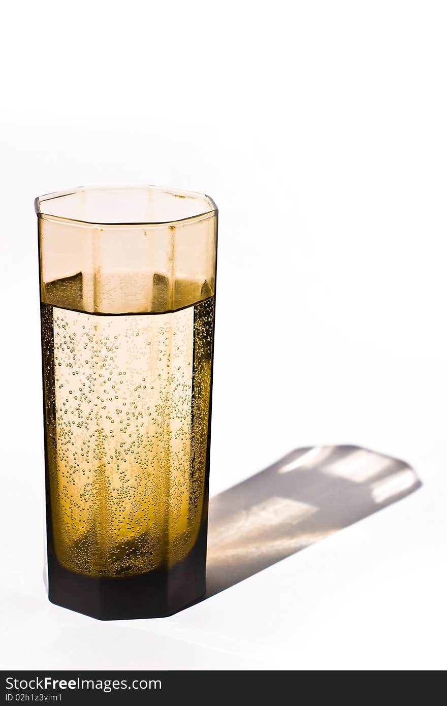 Glass vessels standing on the white table, isolated background