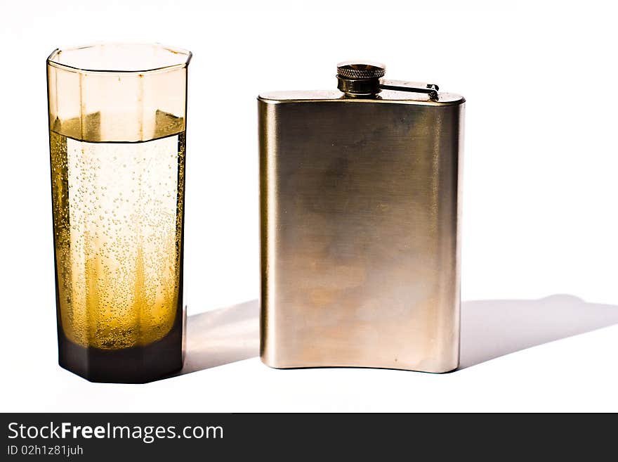 Glass vessels standing on the white table, isolated background