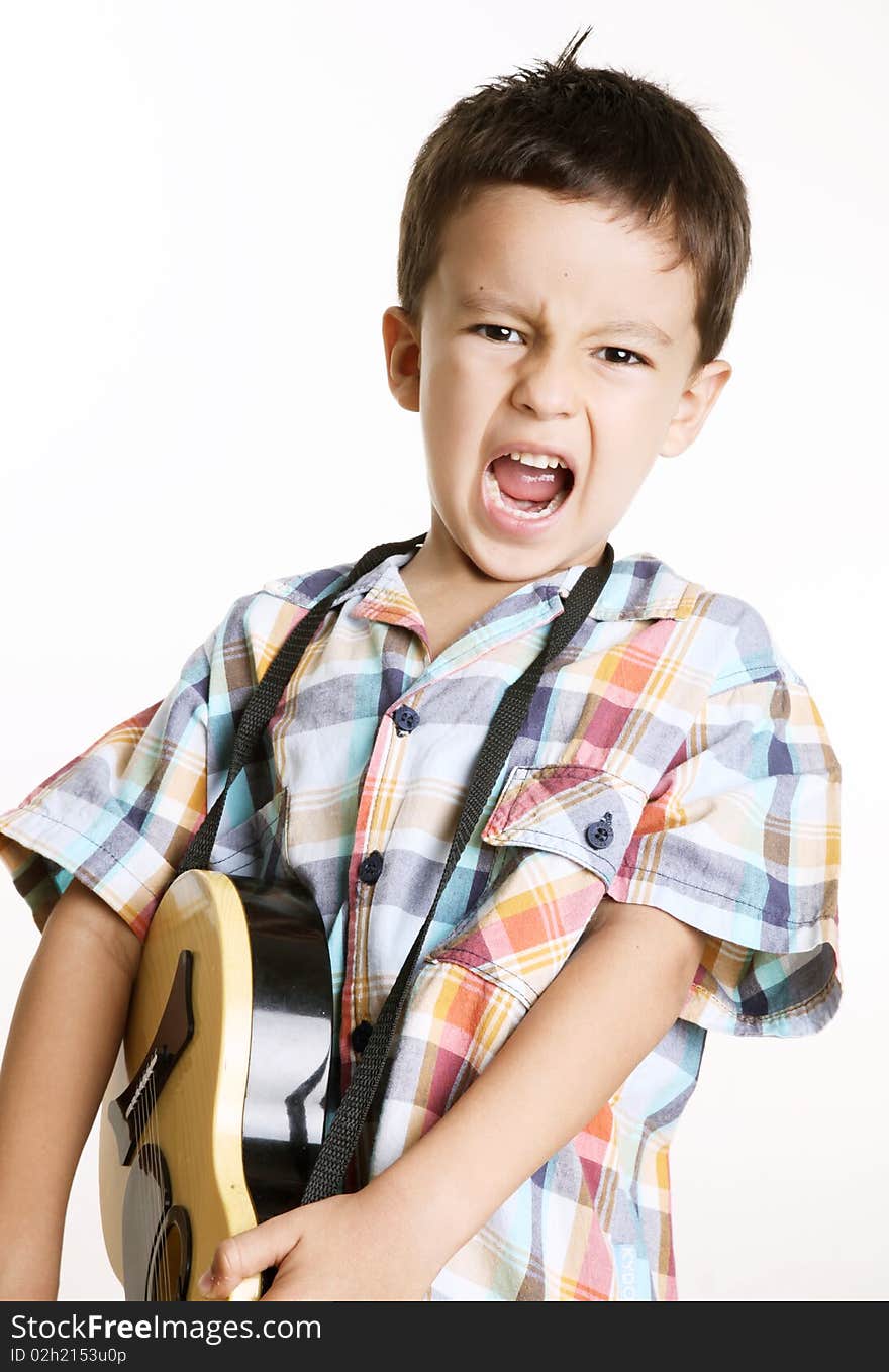 Happy kid playing guitar over white background