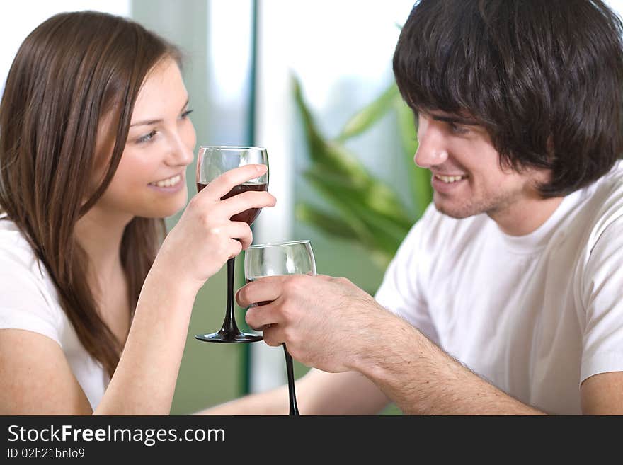 Boy with smile and beautiful girl with wineglasses. Boy with smile and beautiful girl with wineglasses