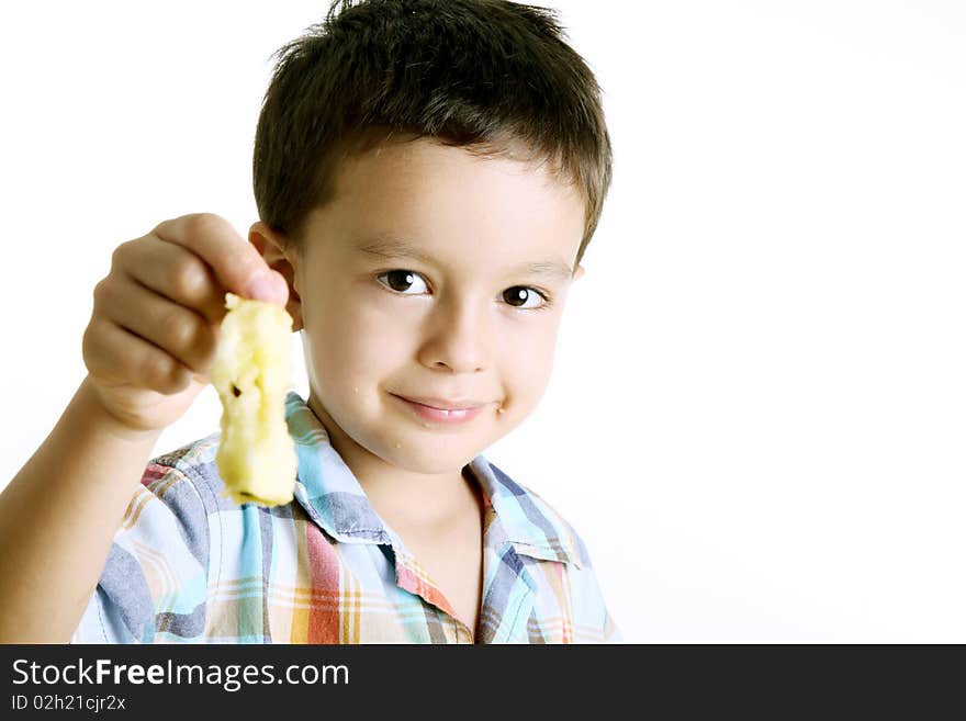 Child looking at the camera and smiling after eating an apple. Child looking at the camera and smiling after eating an apple