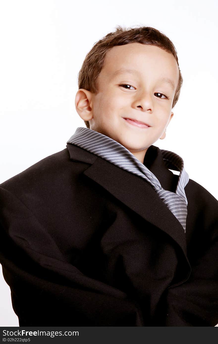 Boy dressed in suit tie over white background. Boy dressed in suit tie over white background