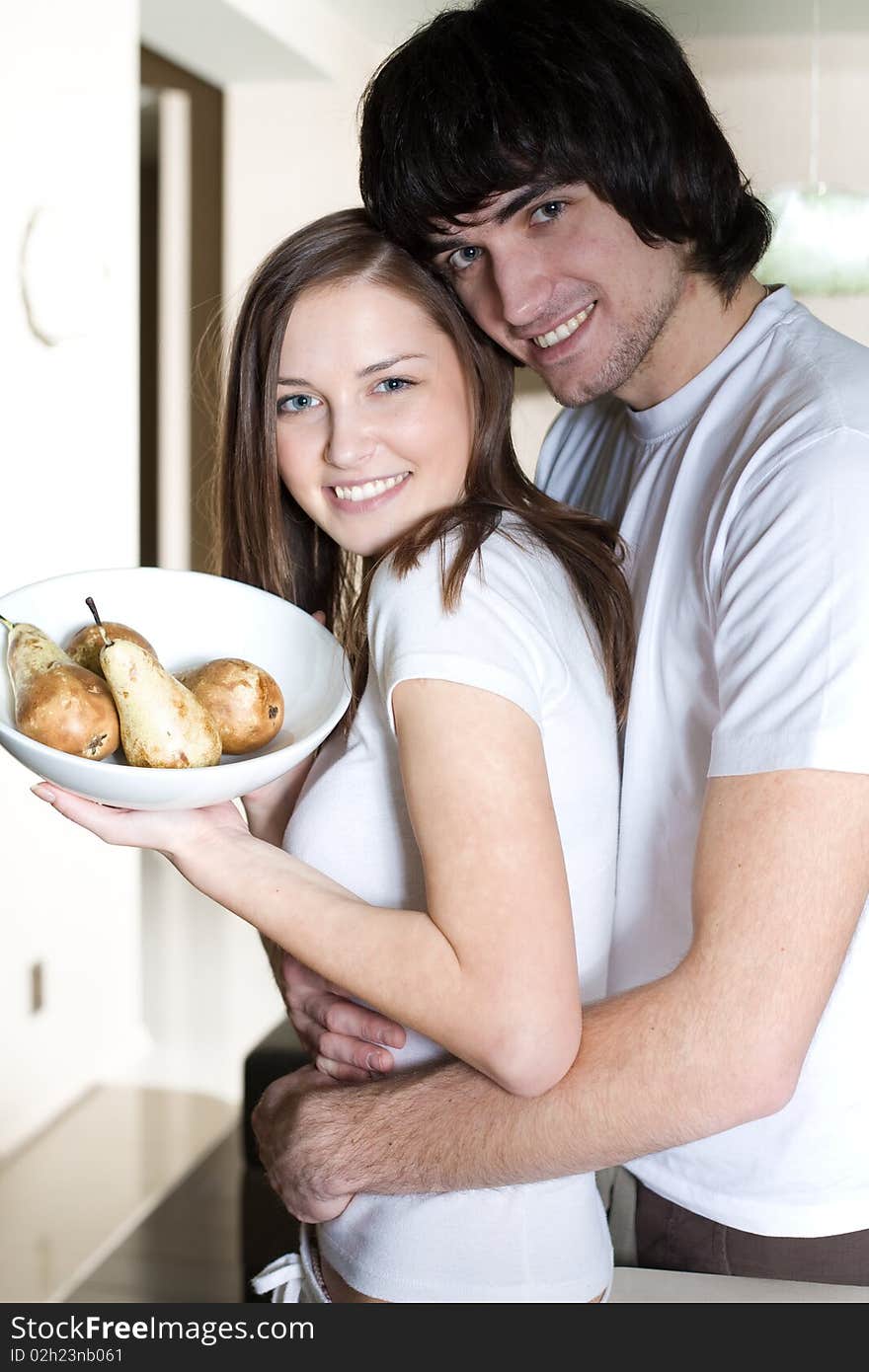 Boy With Smile And Beautiful Girl With Plate