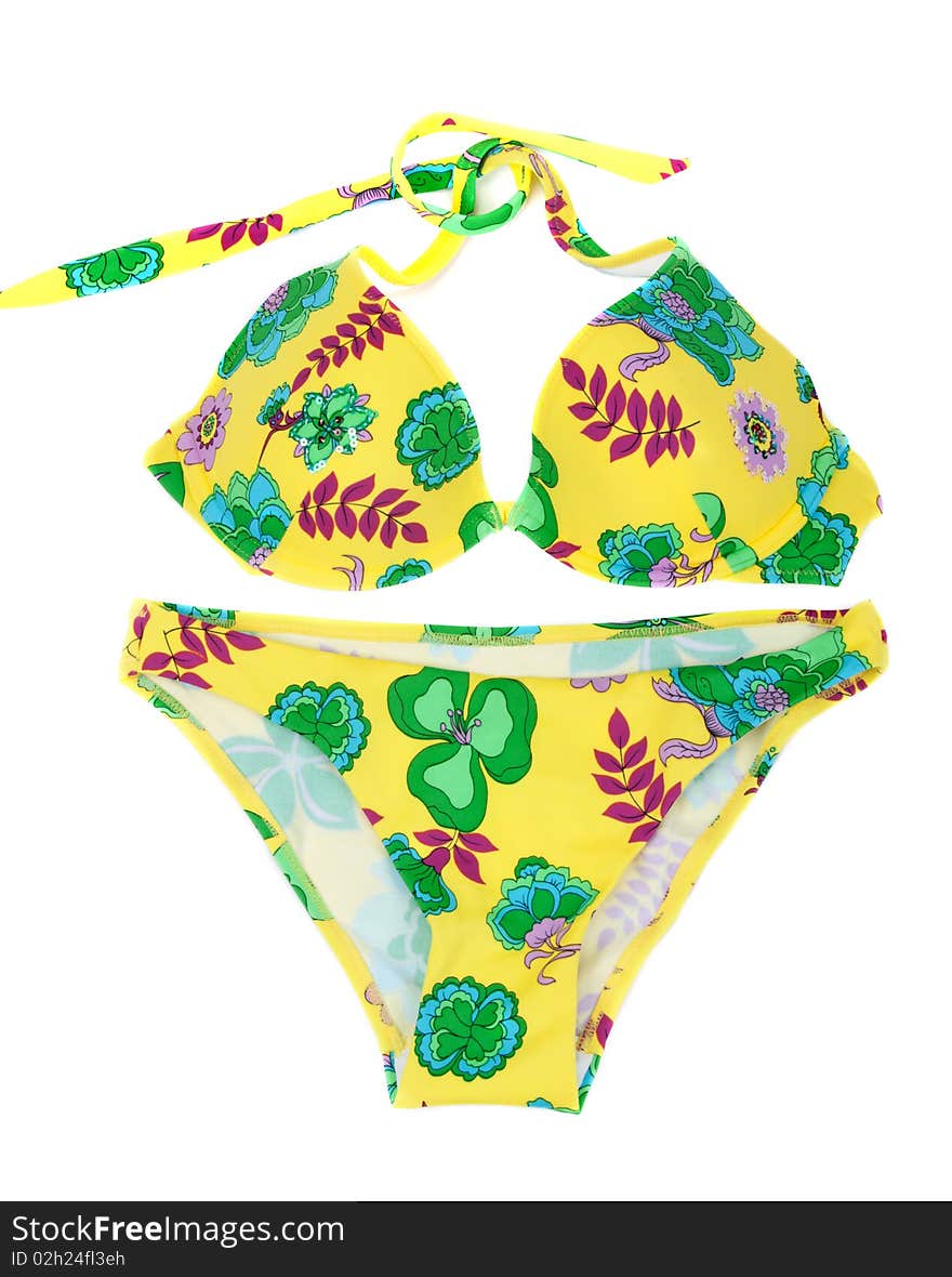 Feminine yellow swimsuit with pattern in form flower isolated on white