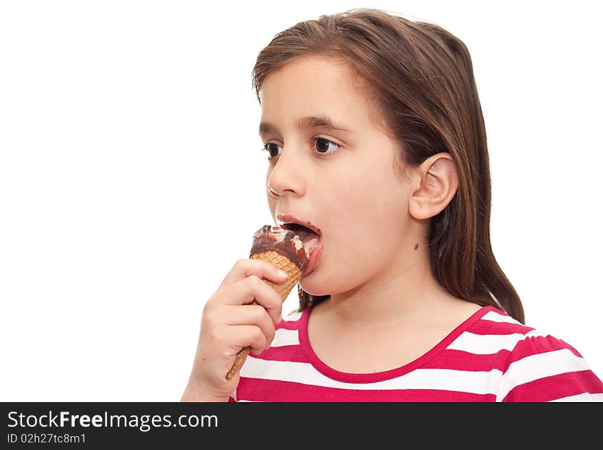 Small girl licking an ice cream cone on a white background