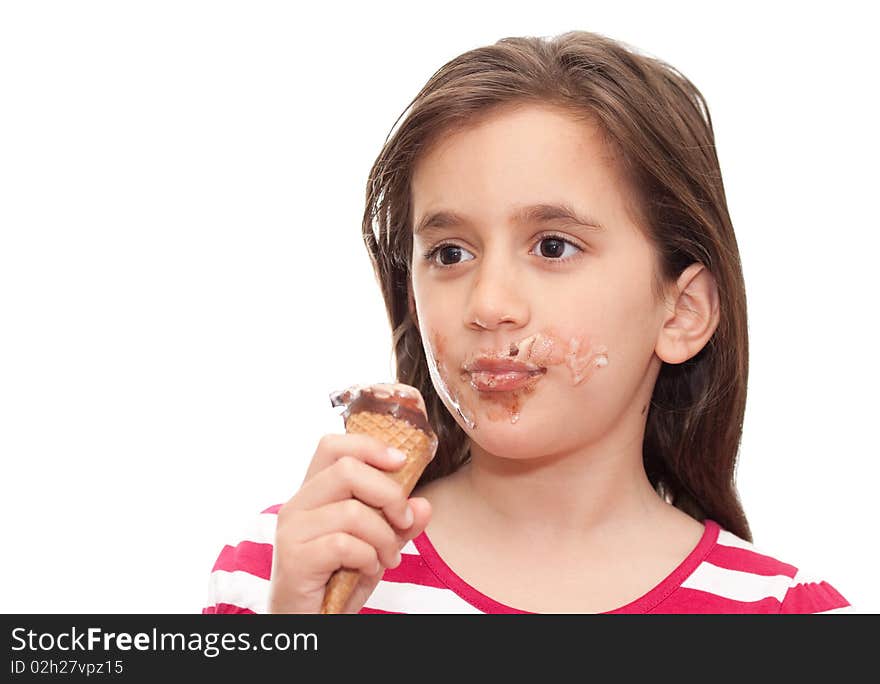 Small girl eating an ice cream cone on a white background