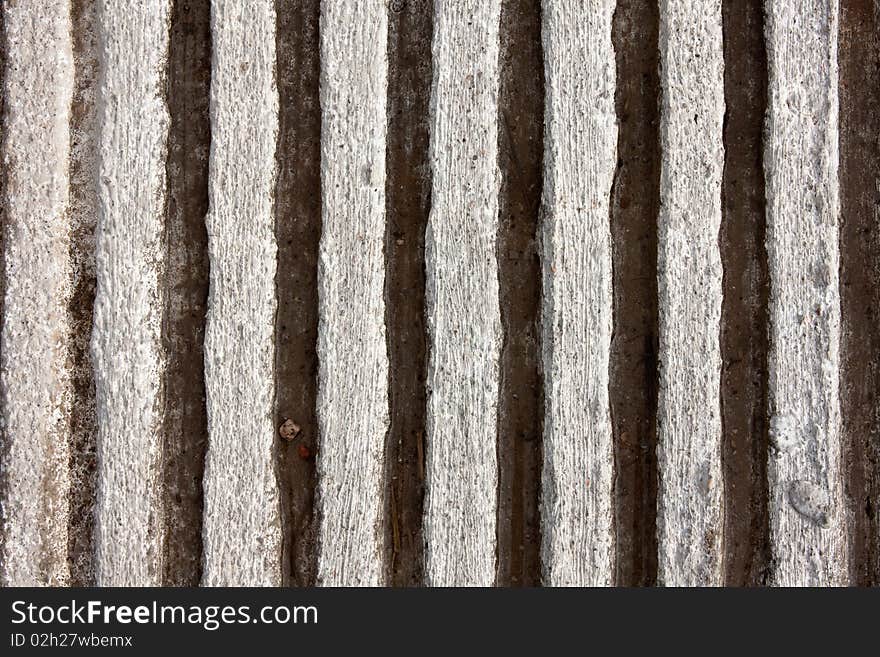 Closeup detail of vertical pattern of corrugated, grooved concrete. Closeup detail of vertical pattern of corrugated, grooved concrete