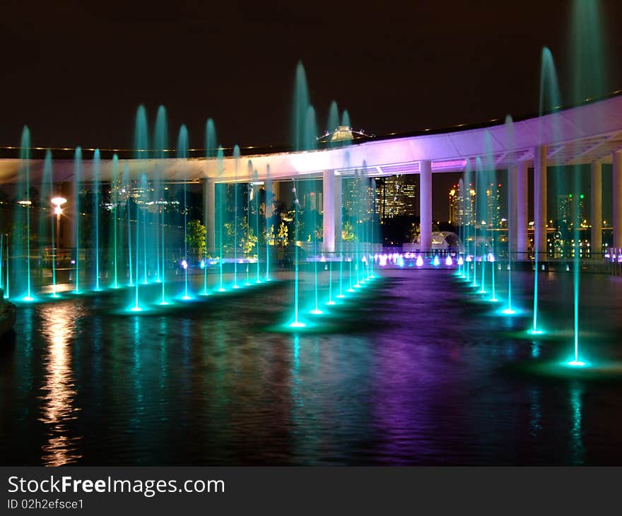 Colourful lighted water fountain at Marina Barrage