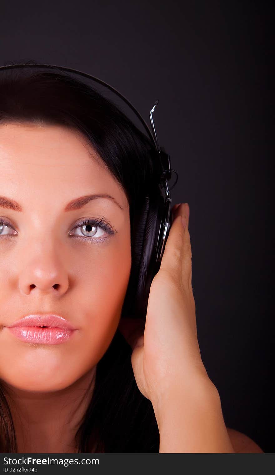 Portrait of woman holding her earphones. Portrait of woman holding her earphones